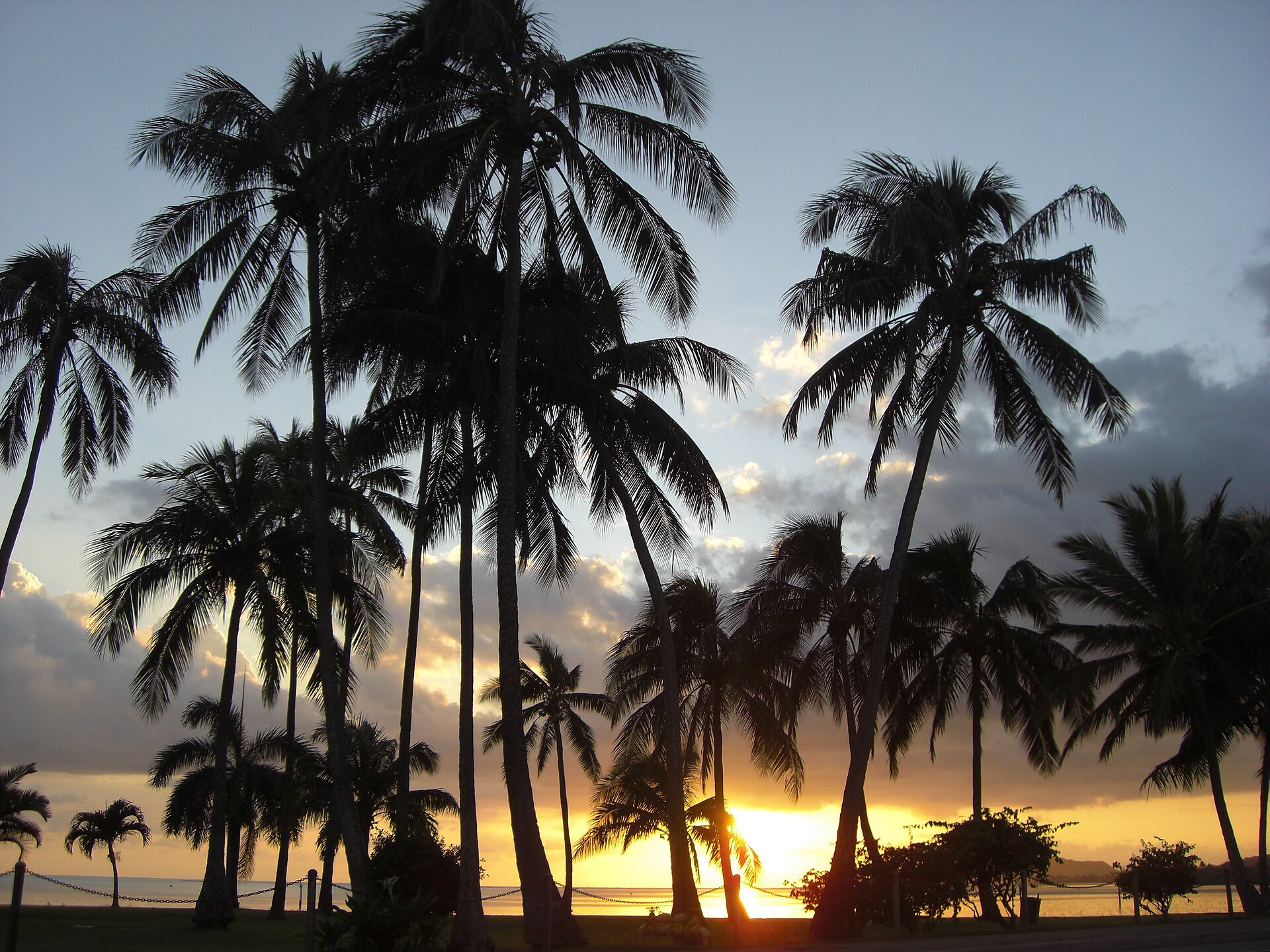 Waikiki Beach, Oahu — beachfront skyline at sunset with Diamond Head in the background